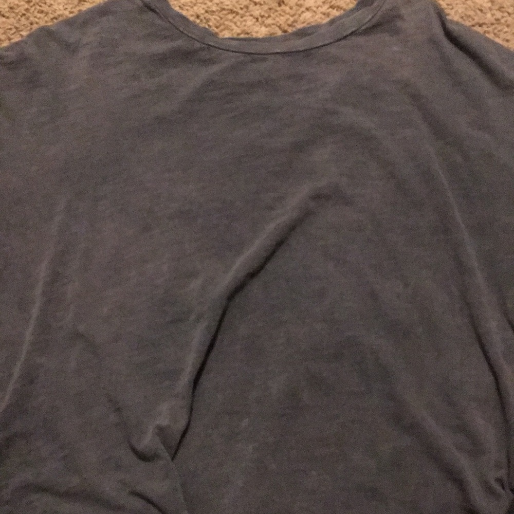 a ruffled gray shirt